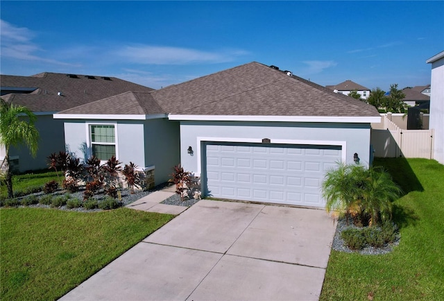 ranch-style house featuring a front yard and a garage