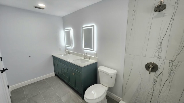 bathroom featuring vanity, walk in shower, toilet, and tile patterned flooring