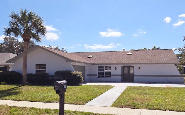 ranch-style home with a front lawn