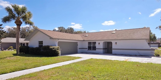 ranch-style house featuring a front yard and a garage