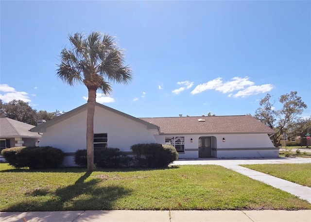 single story home with a front yard