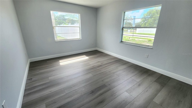 empty room with hardwood / wood-style floors