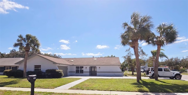 single story home with a front yard