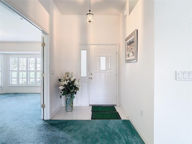 view of carpeted foyer