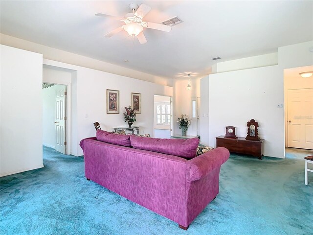 carpeted living room featuring ceiling fan