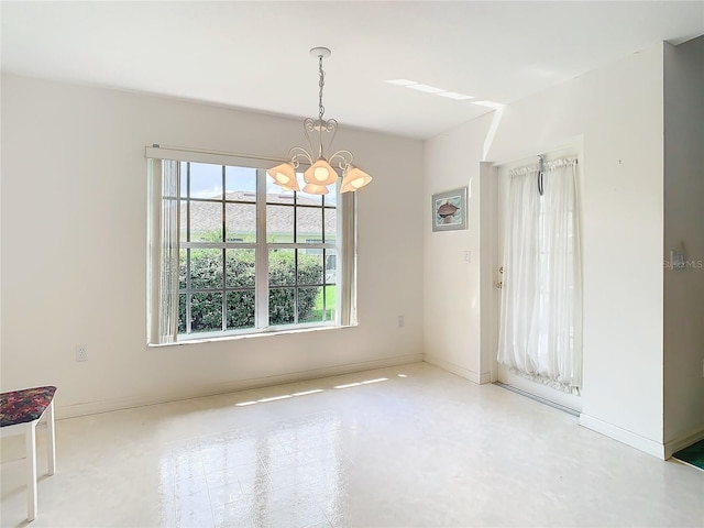 unfurnished dining area with a notable chandelier and a wealth of natural light