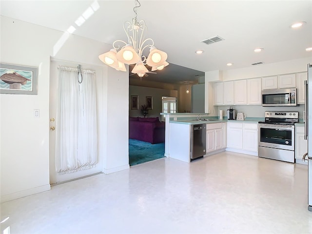 kitchen featuring stainless steel appliances, white cabinets, kitchen peninsula, a notable chandelier, and decorative light fixtures