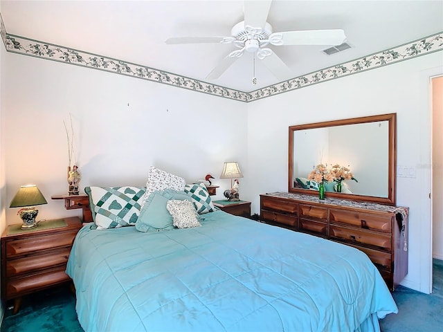 bedroom with ceiling fan and carpet floors