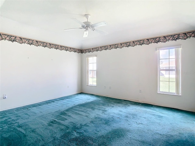 carpeted empty room with ceiling fan