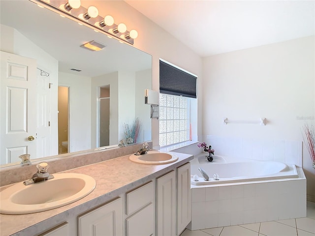 full bathroom with tile patterned flooring, shower with separate bathtub, vanity, and toilet