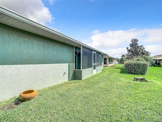 view of yard featuring a sunroom