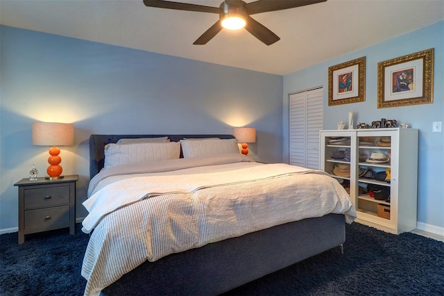 bedroom with dark colored carpet, a closet, and ceiling fan