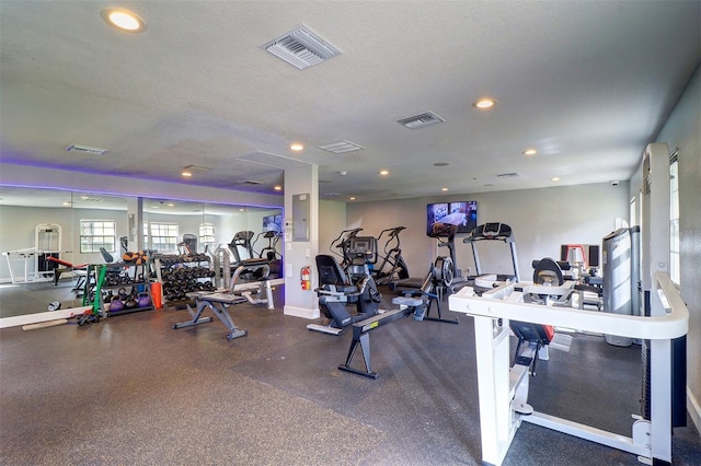 workout area with a textured ceiling