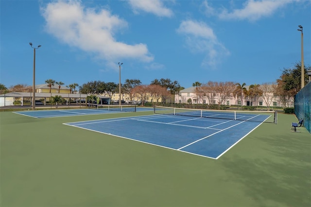 view of sport court with basketball hoop