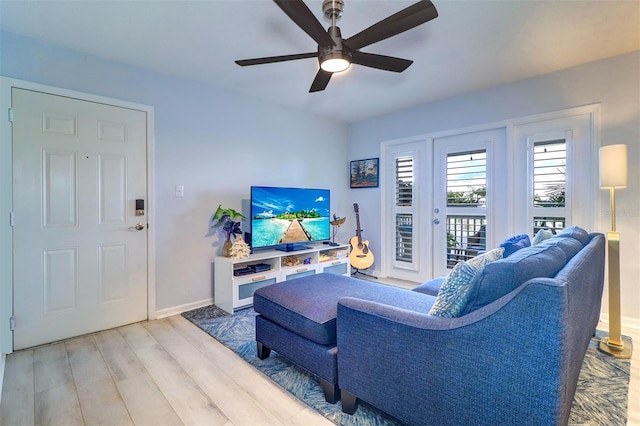 living room with hardwood / wood-style floors and ceiling fan