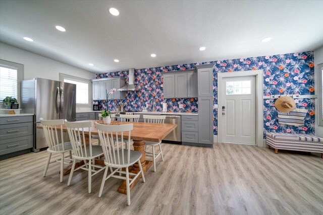 dining room featuring light hardwood / wood-style flooring and a wealth of natural light