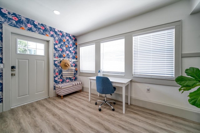 office space with light hardwood / wood-style floors