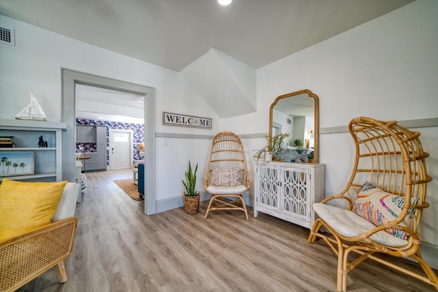 sitting room featuring light hardwood / wood-style floors