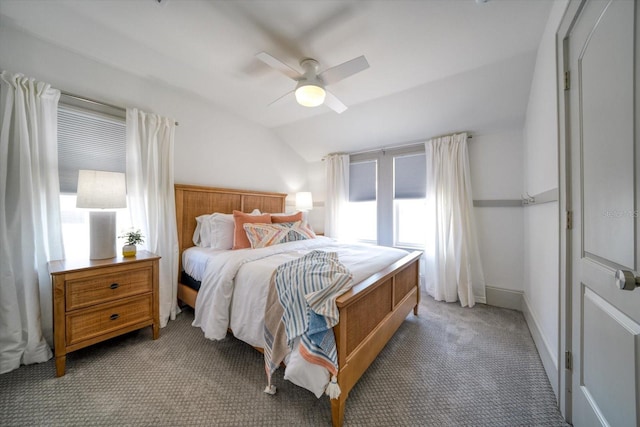 carpeted bedroom with ceiling fan and lofted ceiling