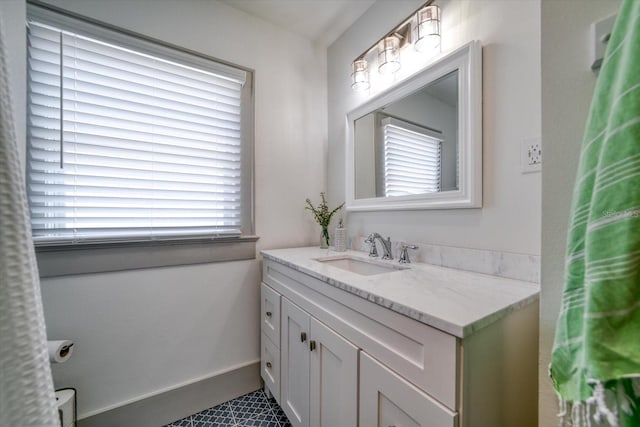 bathroom with vanity, tile patterned floors, and a wealth of natural light