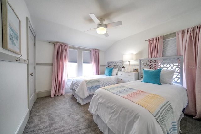 carpeted bedroom featuring ceiling fan and vaulted ceiling