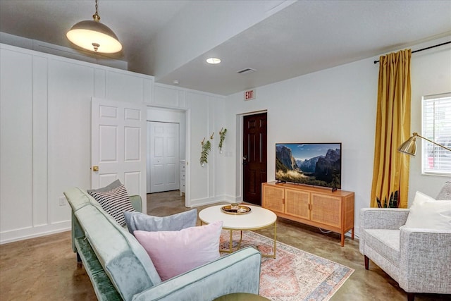 living room featuring concrete flooring