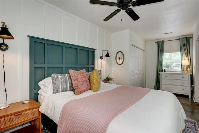 bedroom with ceiling fan and a closet