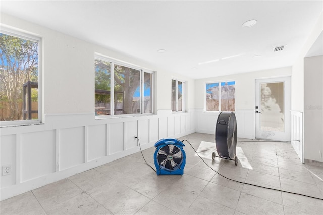 unfurnished sunroom with a healthy amount of sunlight