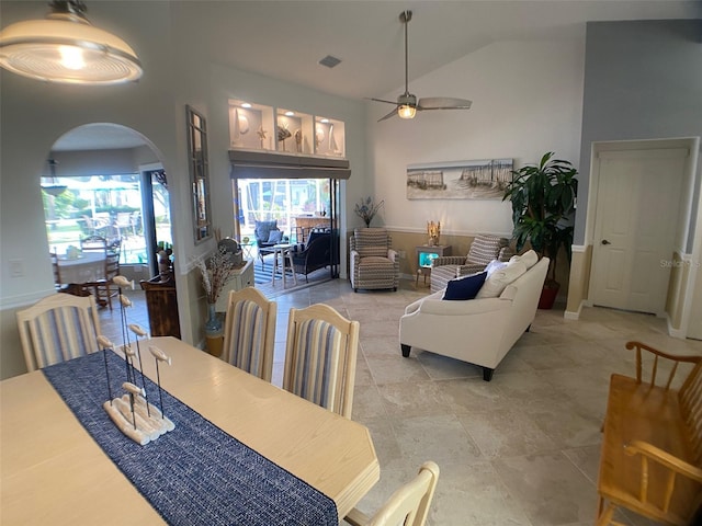 dining space with lofted ceiling and ceiling fan