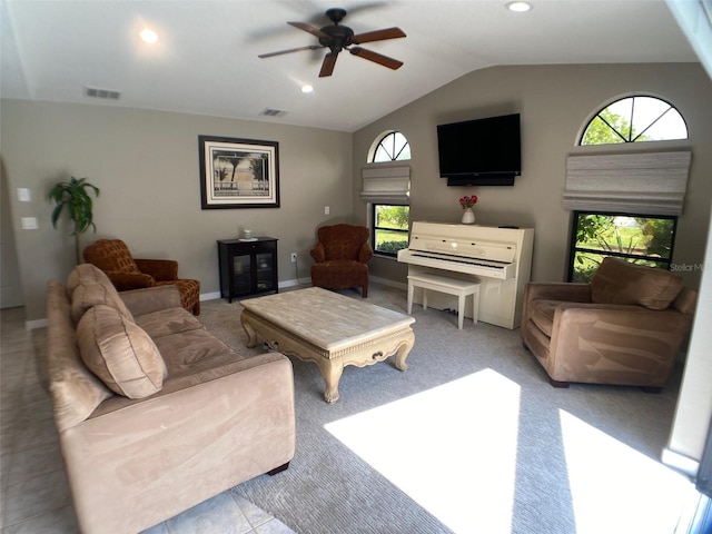 living room featuring ceiling fan and vaulted ceiling