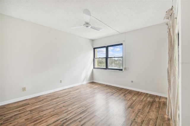 unfurnished room featuring hardwood / wood-style floors, ceiling fan, and a textured ceiling