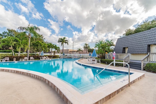 view of swimming pool featuring a patio