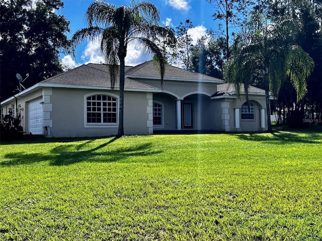 ranch-style house with a front yard and a garage