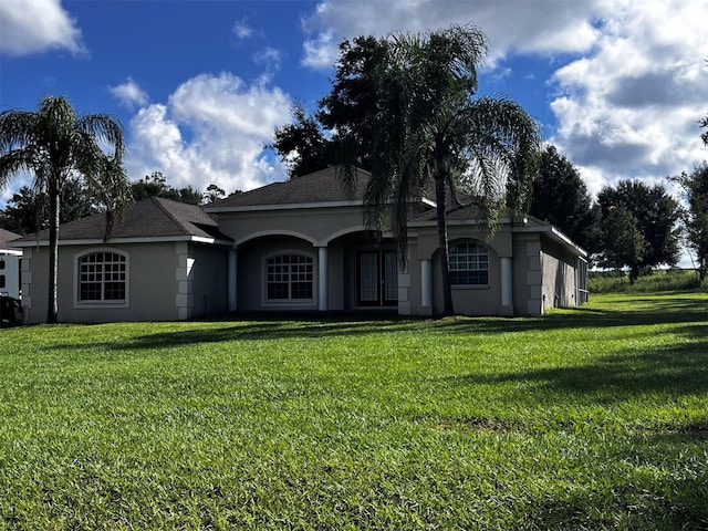 ranch-style house with a front lawn