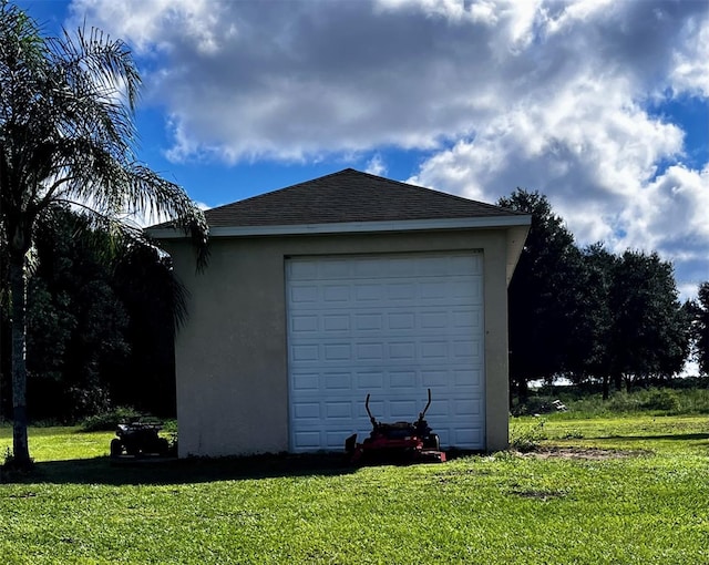 garage with a yard