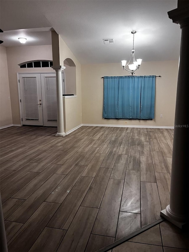 interior space featuring wood-type flooring and a notable chandelier