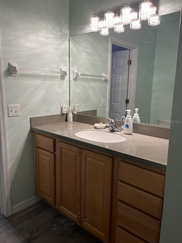 bathroom with wood-type flooring and vanity