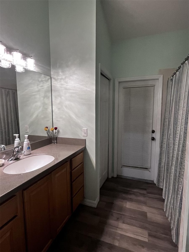 bathroom featuring vanity and hardwood / wood-style flooring