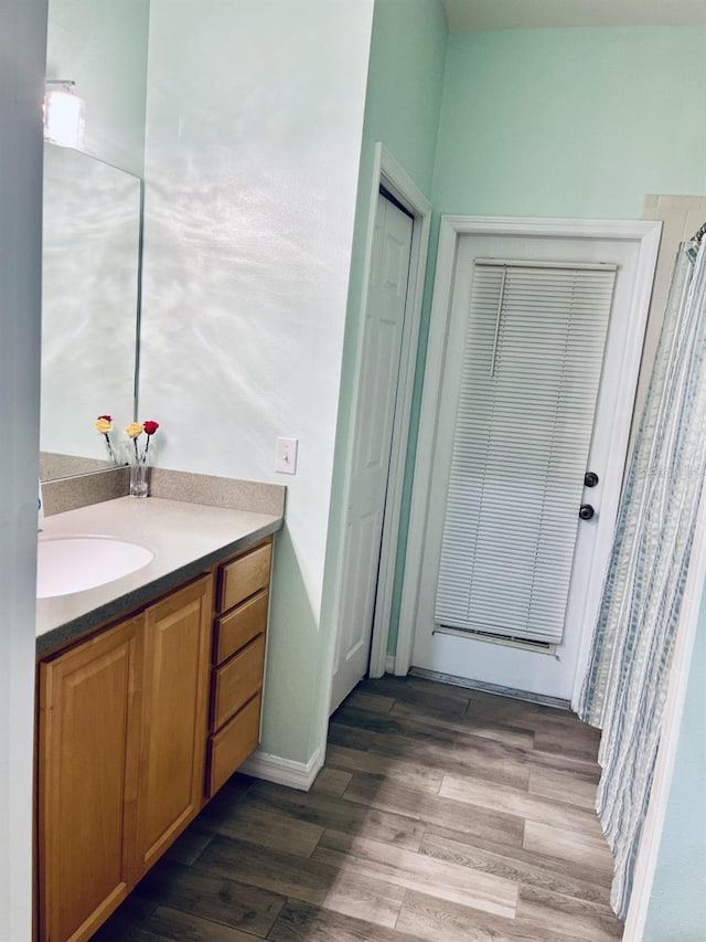 bathroom featuring vanity and hardwood / wood-style floors