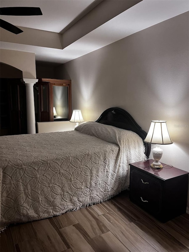 bedroom with ceiling fan and hardwood / wood-style flooring