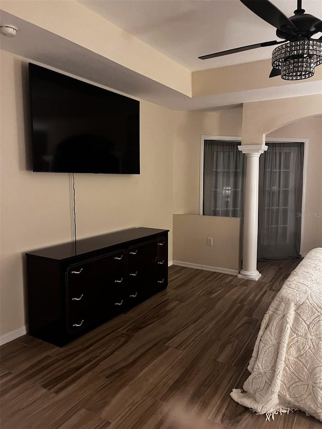 bedroom with ceiling fan and dark wood-type flooring