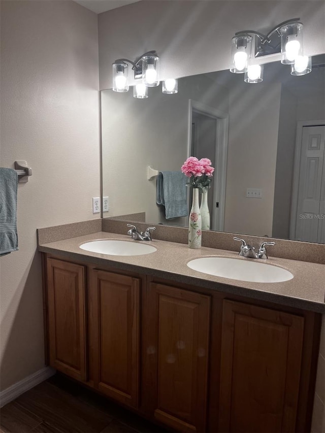 bathroom with wood-type flooring and vanity