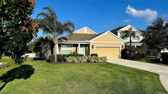 view of front of property with a front yard and a garage