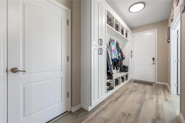 mudroom with light hardwood / wood-style floors