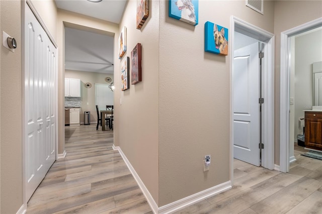 hall featuring light wood-type flooring