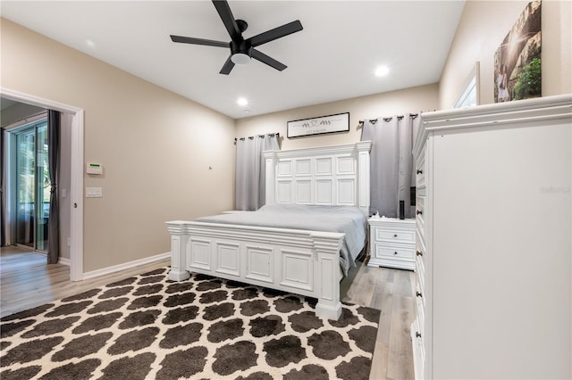 bedroom with ceiling fan and hardwood / wood-style flooring