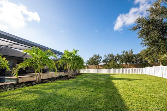 view of yard with a lanai