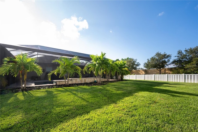 view of yard with a lanai