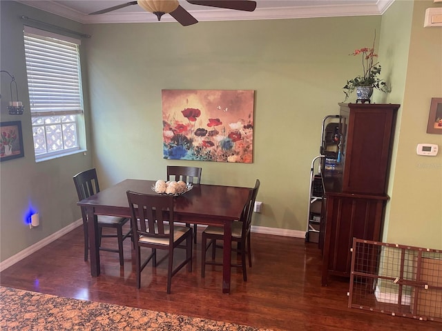 dining room with ceiling fan, dark hardwood / wood-style flooring, and ornamental molding