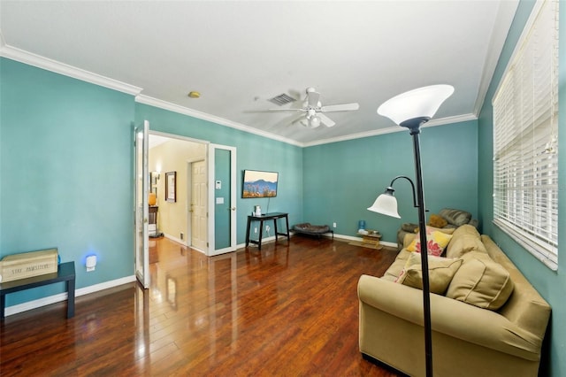 living room featuring ceiling fan, ornamental molding, and dark hardwood / wood-style floors